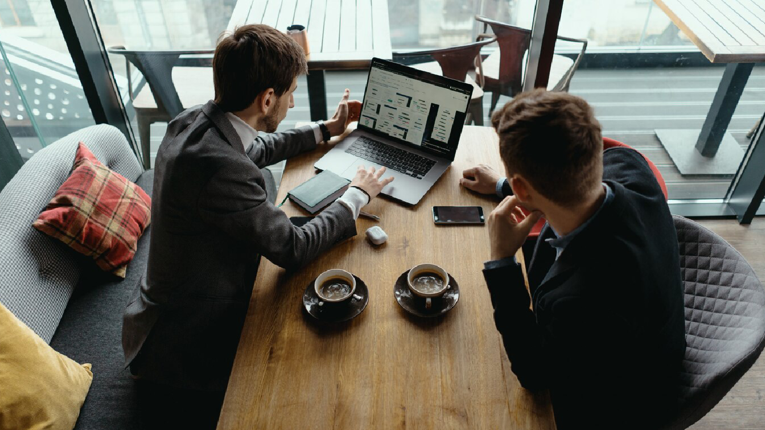 Expert hotel consultant negotiating brand partnerships for hotel owners